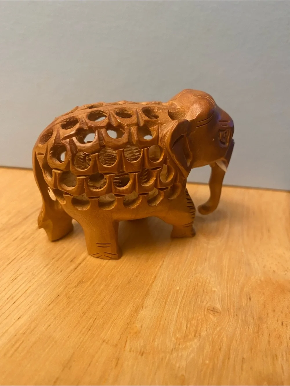 Hand-Carved Wooden Elephant Figurine in Warm Brown with baby elephant in stomach